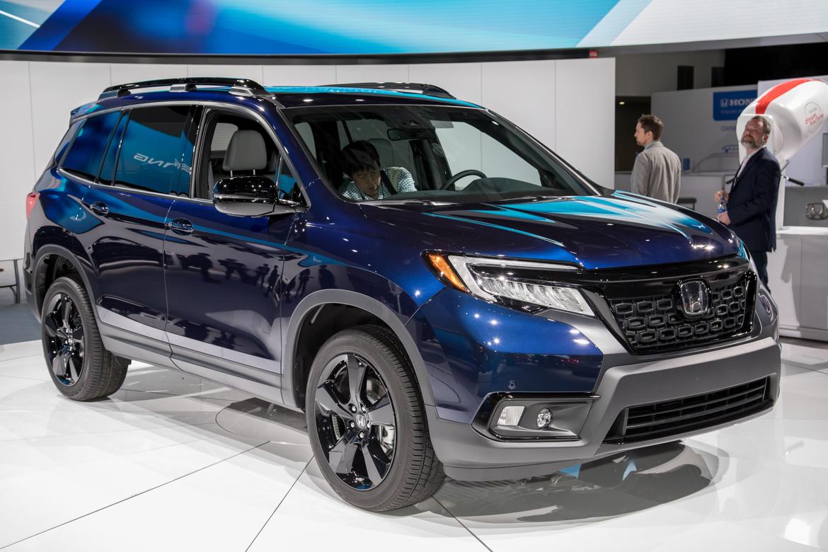 01-<a href=https://www.sharperedgeengines.com/used-honda-engines>honda</a>-passport-2019-angle--blue--exterior--front.jpg