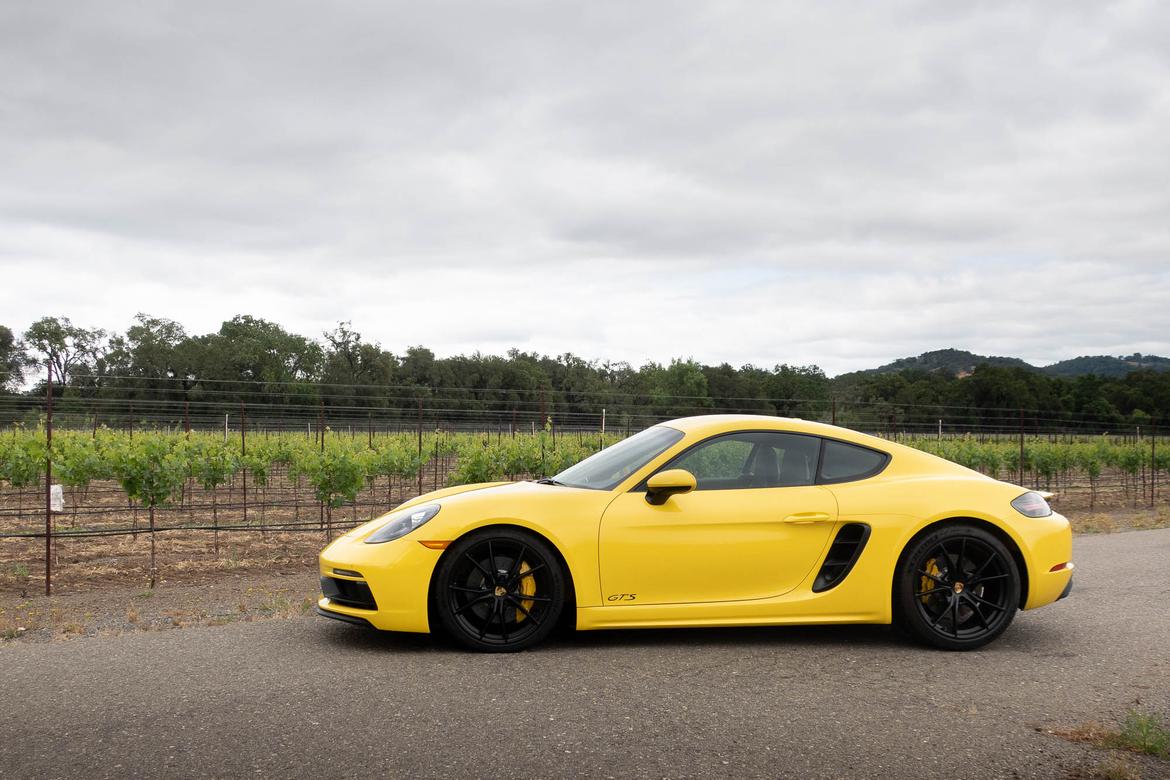 05-<a href=https://www.sharperedgeengines.com/used-porsche-engines>porsche</a>-718-cayman-gts-2018-exterior-profile-yellow.jpg