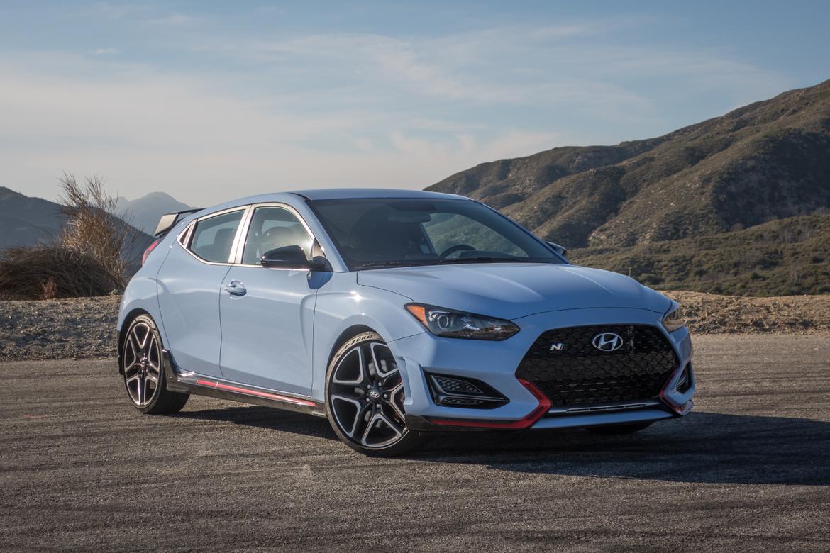 01-<a href=https://www.sharperedgeengines.com/used-hyundai-engines>hyundai</a>-veloster-n-2019-angle--blue--exterior--front--orange.