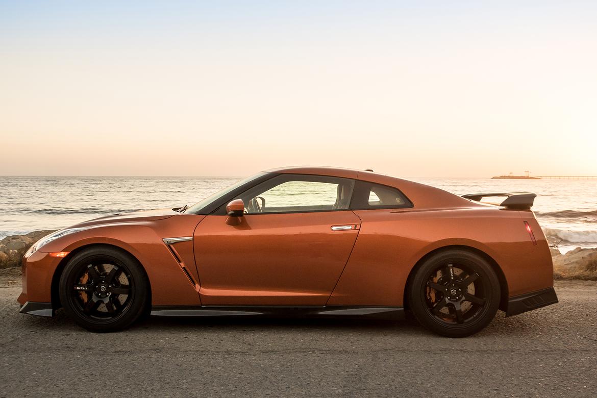 03-<a href=https://www.sharperedgeengines.com/used-nissan-engines>nissan</a>-gt-r-2018-beach--dusk--exterior--orange--outdoors--pro