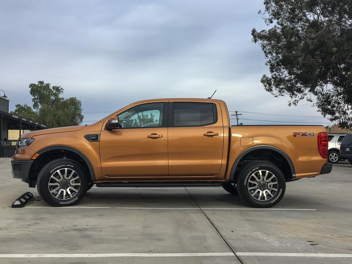 03-<a href=https://www.sharperedgeengines.com/used-ford-engines>ford</a>-ranger-2019-exterior--orange--profile.jpg